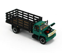 
              NEW 2021 1:64 DCP *GREEN & BLACK* Chevrolet C65 Tandem-Axle STAKEBED TRUCK NIB
            